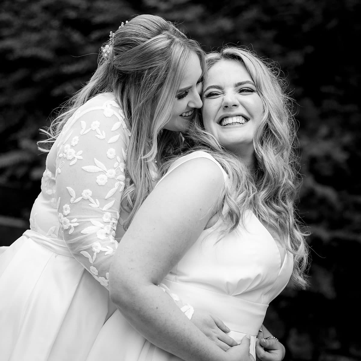 Two brides having fun during a same sex wedding