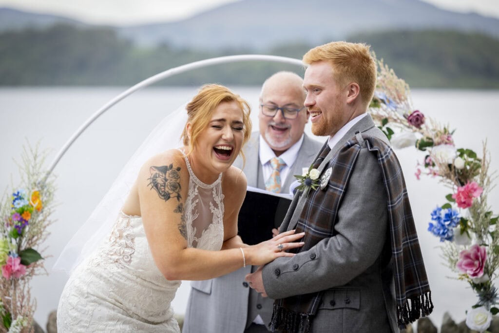 relaxed, natural wedding photography as the couple crack up during the vows