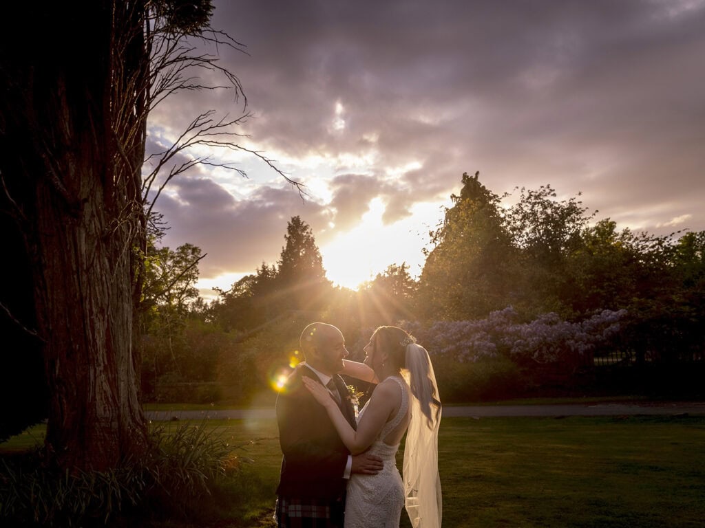 Relaxed couple portrait on The Cruin as the sun goes down