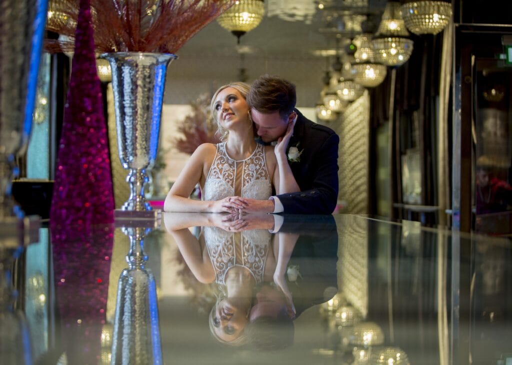 Couple kissing outside Corinthian Glasgow wedding venue in the boutique room