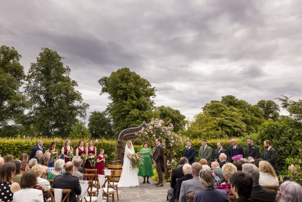 Couple exchanging vows at Loch Lomond Arms wedding in Luss