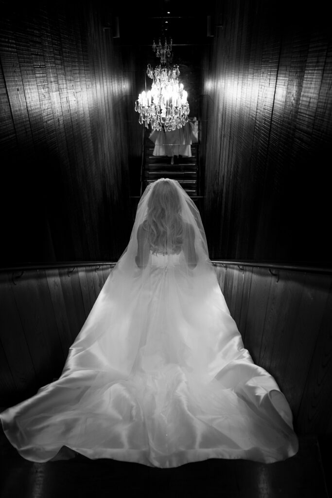 Bride makes her way to her guests during her wedding at the Corinthian