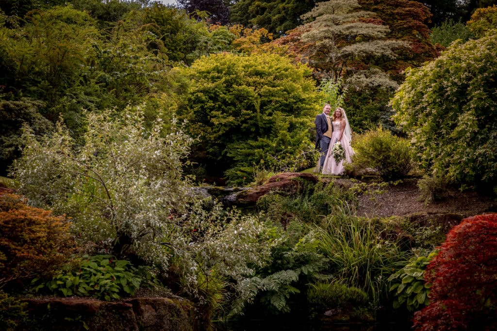 Bride and groom in the gardens of Mount Stuart on the wedding day