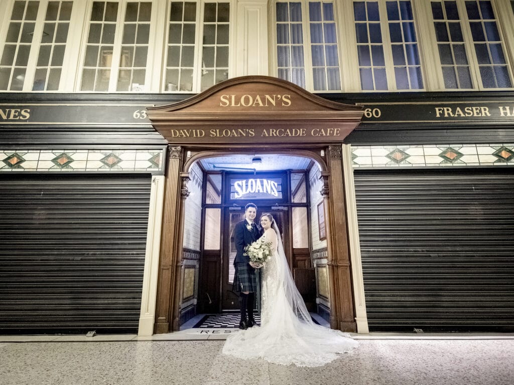 Couple at Sloans’ secret Argyll Arcade entrance.