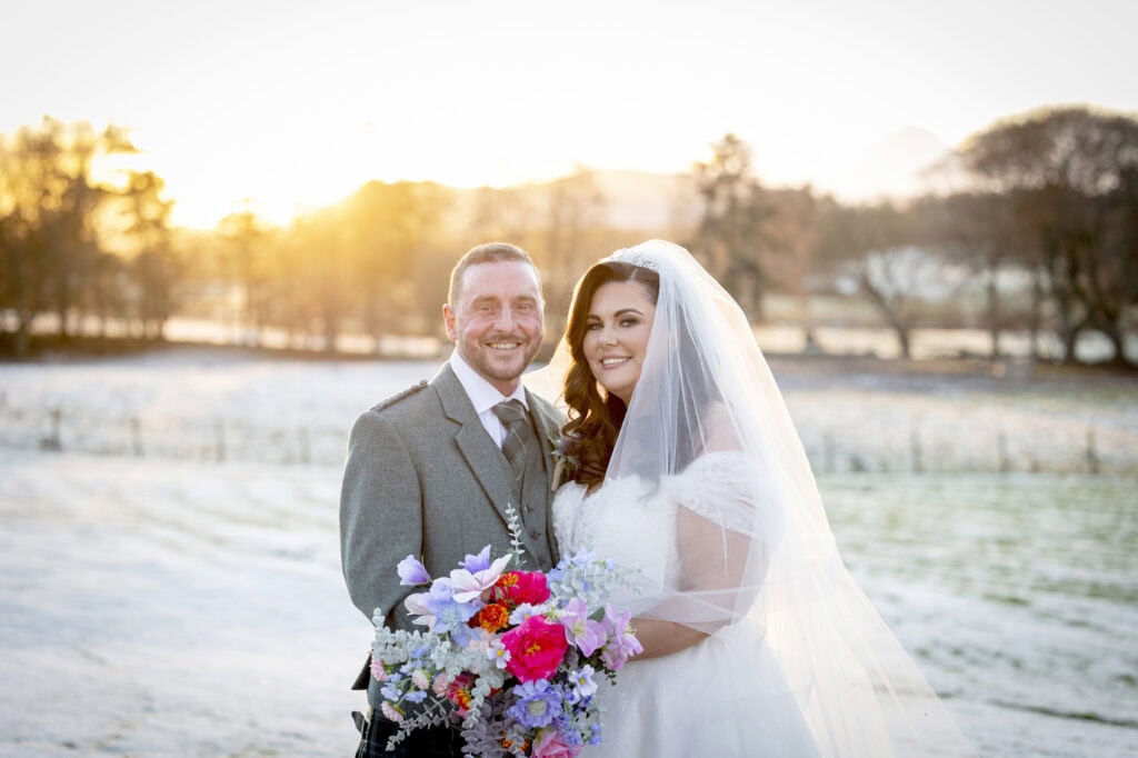 winter wedding couple in the snow