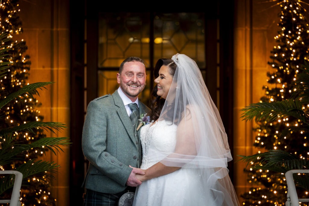 bride and groom pose on their wedding day 